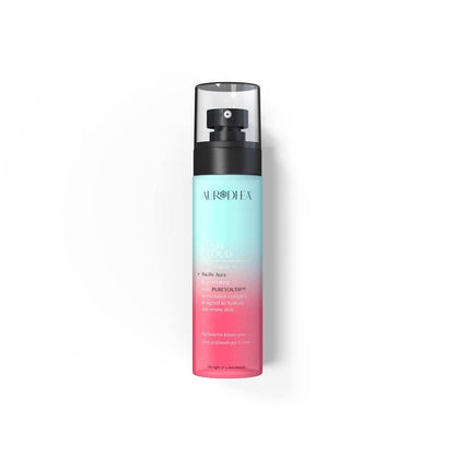 Aurodhea Lush Cloud SBM002 – Parfümiertes Körperspray Pacific Aura 100 ml mit PUREYOUTH™ Komplex, türkis-rosa Flasche auf weißem Hintergrund